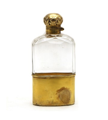 Lot 56 - A late Victorian silver-gilt and clear glass hip flask