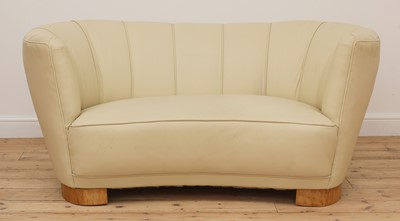 Lot 243 - An Art Deco cream leather settee