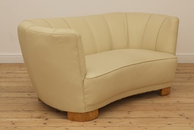 Lot 243 - An Art Deco cream leather settee