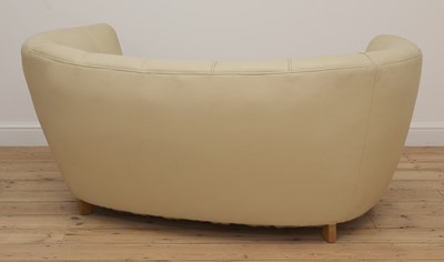 Lot 243 - An Art Deco cream leather settee