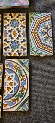 Lot 264 - A collection of fourteen moulded Azulejos style tiles