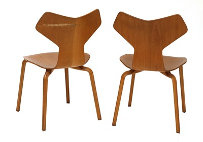 Lot 591 - A pair of teak 'Grand Prix' chairs
