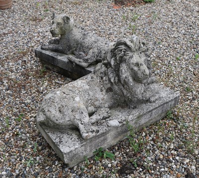 Lot 322 - A composition stone lion and lioness