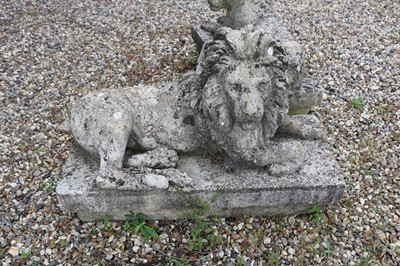 Lot 322 - A composition stone lion and lioness
