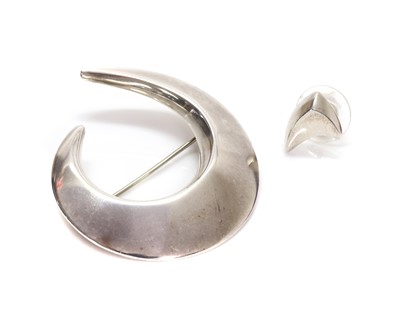 Lot 418 - A sterling silver asymmetrical crescent brooch, by Georg Jensen