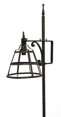 Lot 128 - An Arts and Crafts wrought iron standard lamp