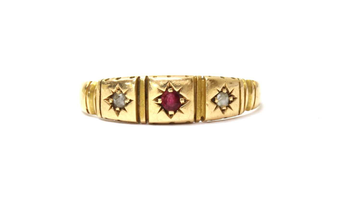 Lot 9 - A 15ct gold ruby and diamond three stone ring