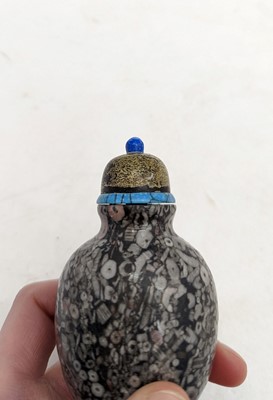 Lot 146 - A Chinese crinoid marble snuff bottle