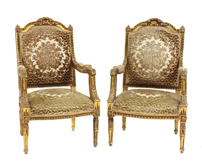 Lot 498 - A pair of Louis XVI style giltwood armchairs