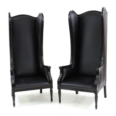 Lot 490 - A pair of contemporary high backed wing chairs