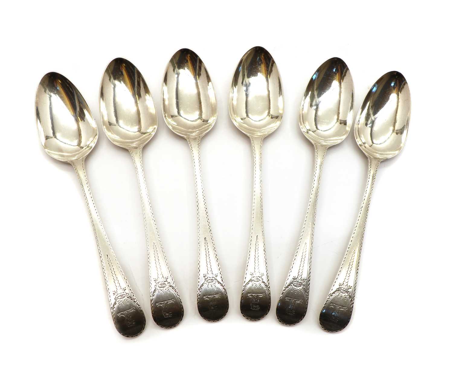 Lot 41 - A George III set of six silver bright-cut engraved tablespoons