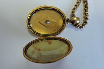 Lot 65 - A Victorian gold diamond set locket and chain