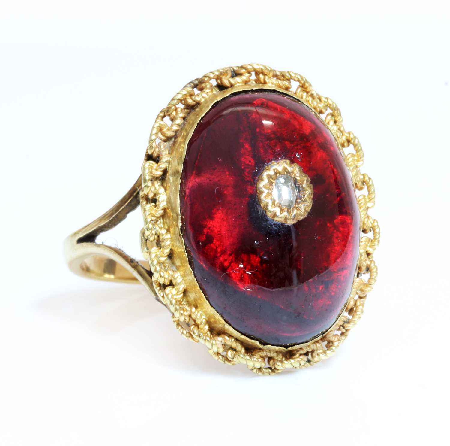 Lot 60 - A Victorian cabochon garnet and diamond later mounted as a ring