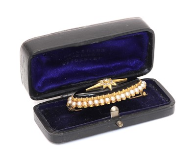 Lot 114 - A Victorian gold marquise shaped onyx brooch