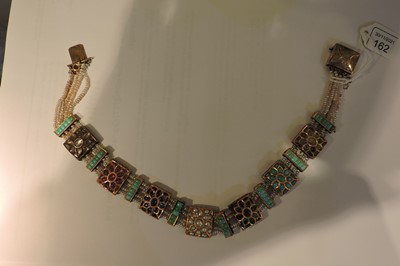 Lot 162 - An Indian four row seed pearl and gemstone necklace