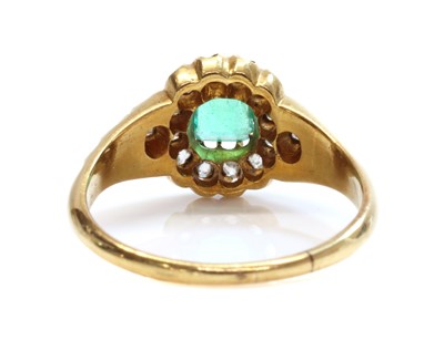 Lot 107 - A late Victorian emerald and diamond cluster ring