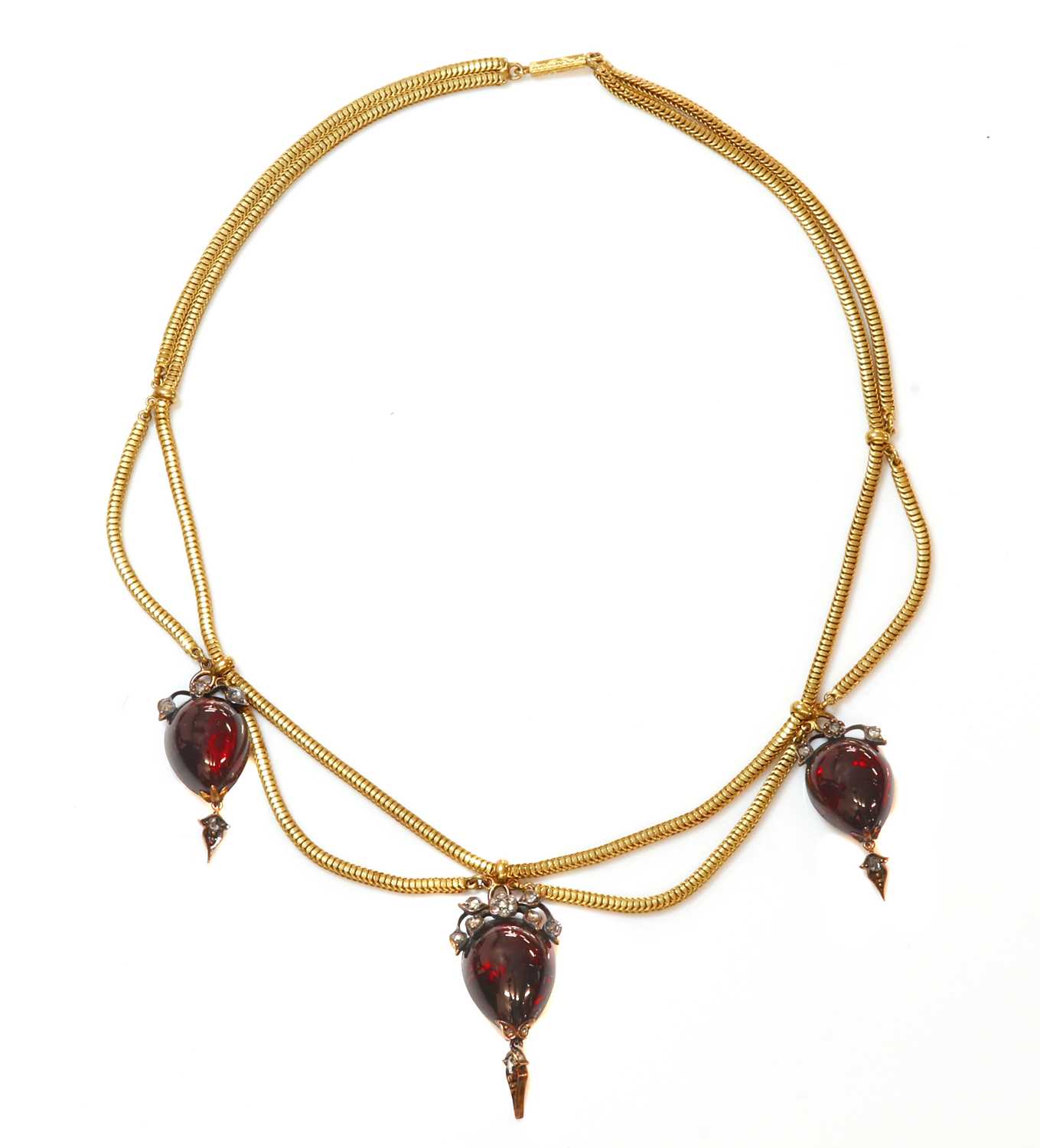 Lot 53 - A Victorian gold cabochon garnet and diamond swag necklace, c.1850