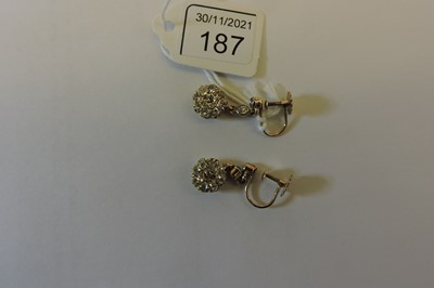 Lot 187 - A pair of Edwardian diamond set drop earrings