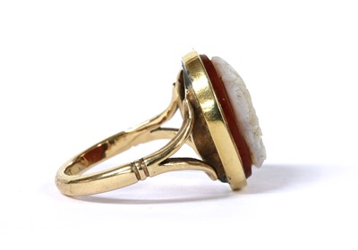 Lot 1045 - A gold hardstone cameo ring