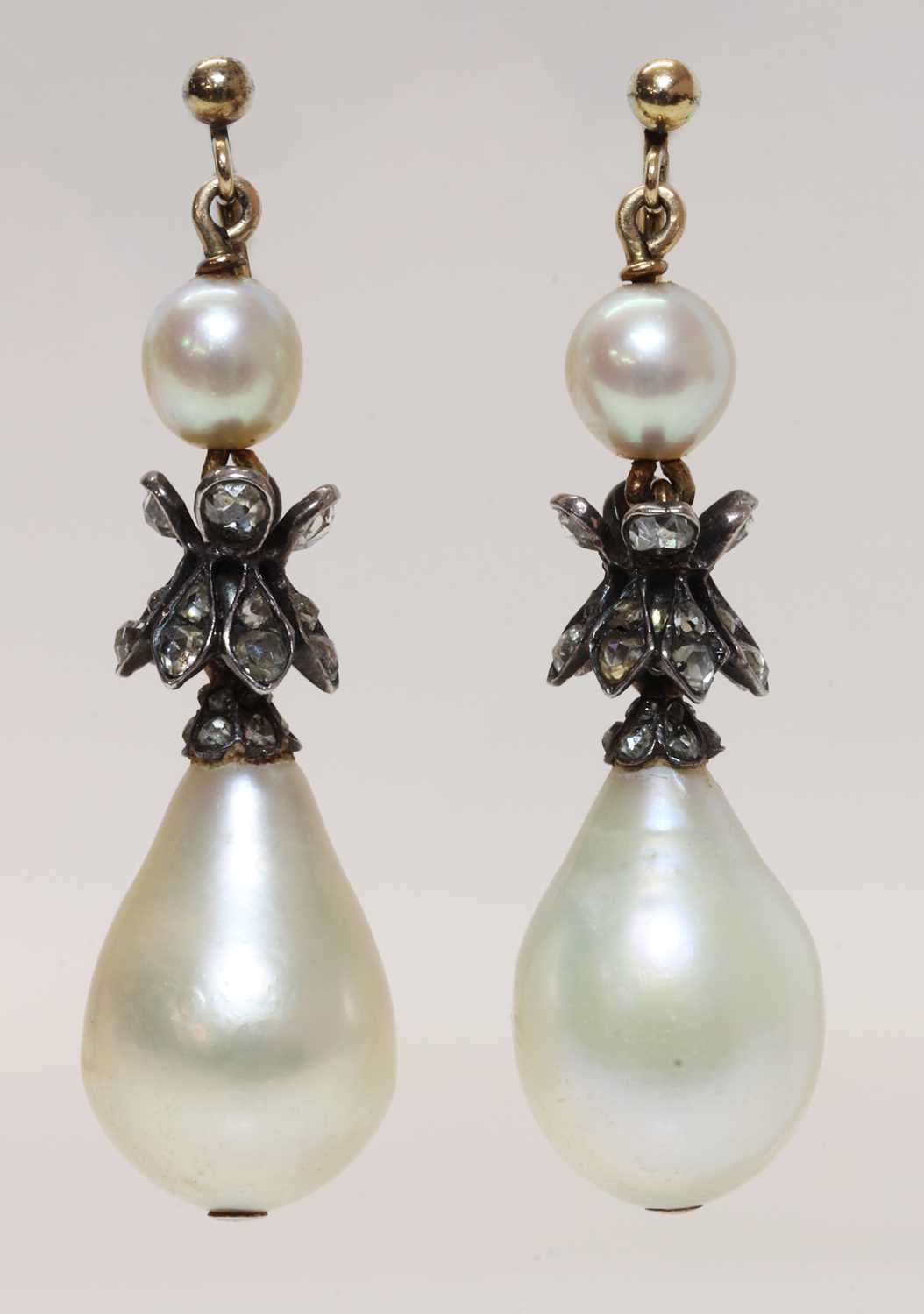 Lot 141 - A pair of natural saltwater pearl and diamond drop earrings