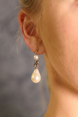 Lot 141 - A pair of natural saltwater pearl and diamond drop earrings