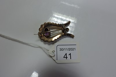 Lot 41 - A Georgian paste and split pearl lyre brooch