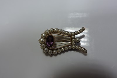 Lot 41 - A Georgian paste and split pearl lyre brooch