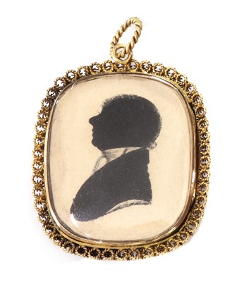 Lot 28 - A Regency gold mounted painted silhouette pendant