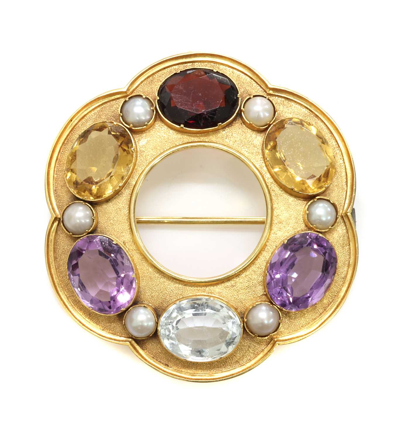 Lot 74 - A Victorian gold gemstone set hexafoil circle brooch