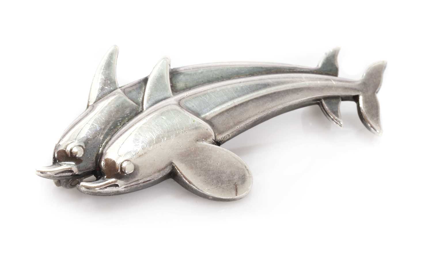 Lot 423 - A sterling silver dolphin 'Hawaii' brooch, by Georg Jensen