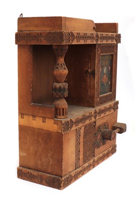 Lot 35 - A chip-carved wooden wall-hanging cabinet