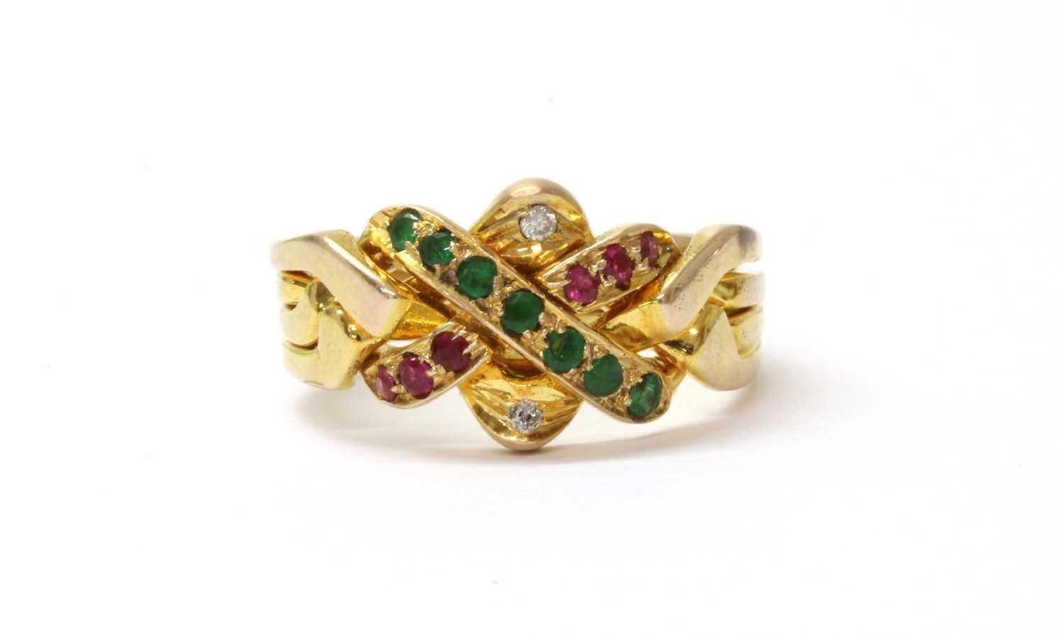 Lot 135 - A gold emerald. ruby and diamond set puzzle ring