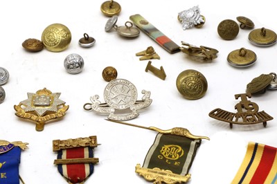 Lot 52 - A collection of military badges buttons and medals