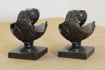 Lot 215 - A pair of grand tour bronze candlesticks