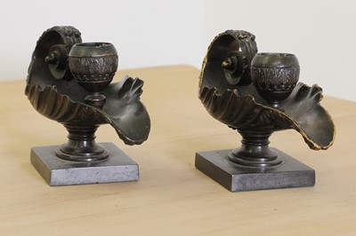 Lot 215 - A pair of grand tour bronze candlesticks