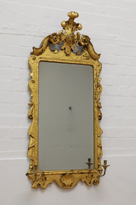 Lot 347 - A George II-style carved giltwood wall mirror