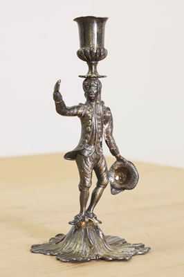 Lot 634 - A George III cast silver gilt figural taper stick