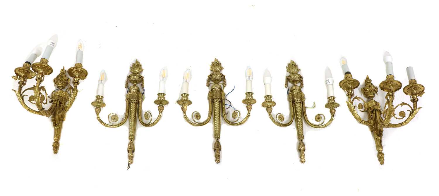 Lot 50 - A pair of gilt-bronze three-branch wall lights