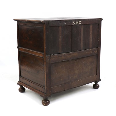 Lot 232 - An oak geometric fronted chest