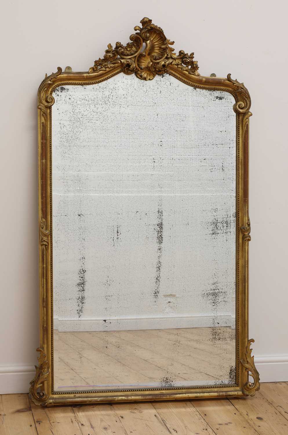 Lot 142 - A gilt-framed pier mirror