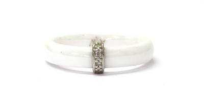 Lot 209 - A white ceramic diamond set ring