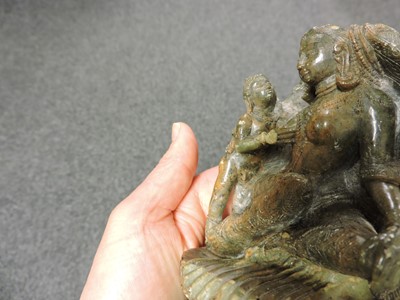 Lot 278 - A soapstone carving of a Bodhisattva with child