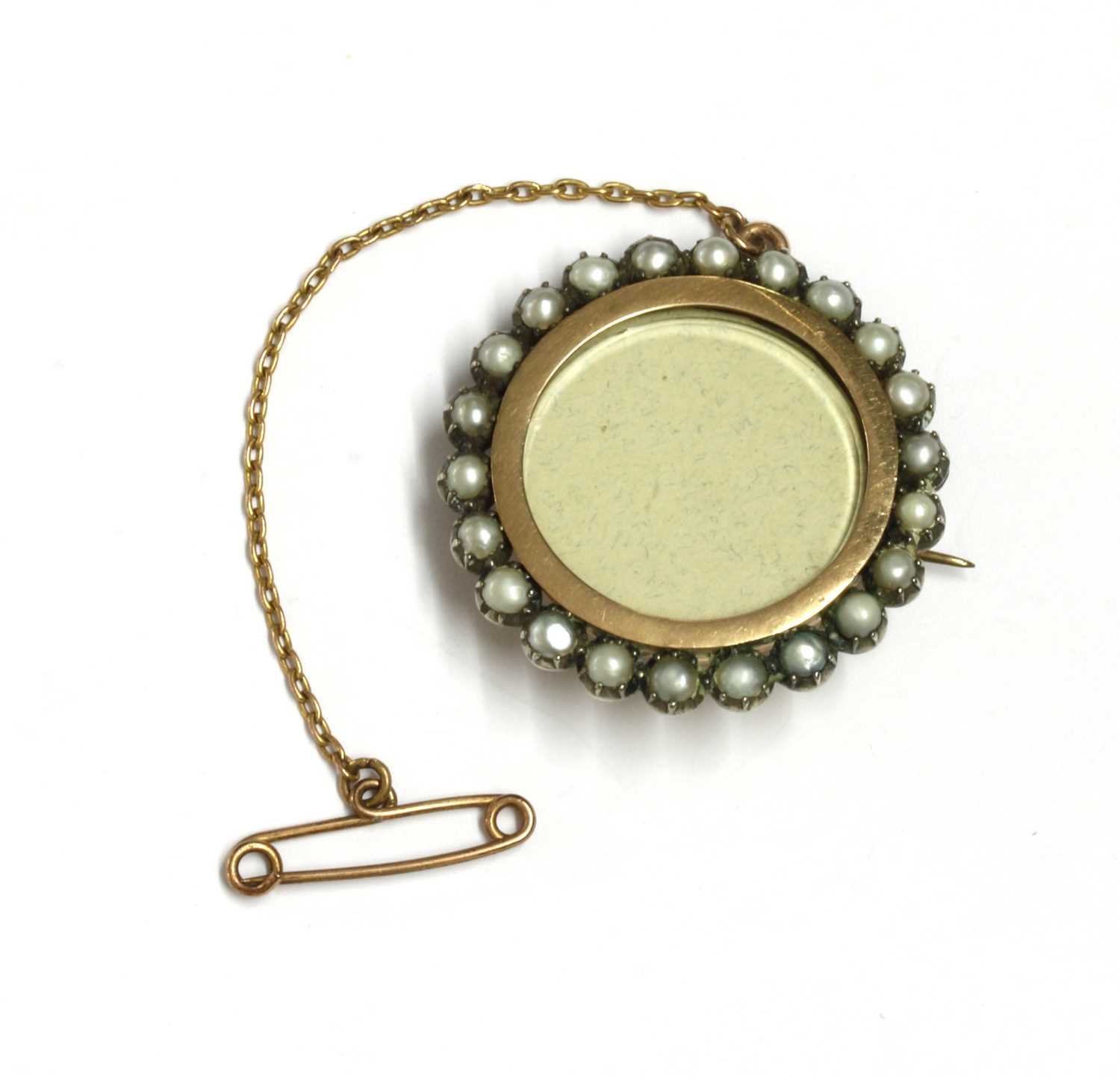 Lot 21 - A gold and silver, split pearl set brooch
