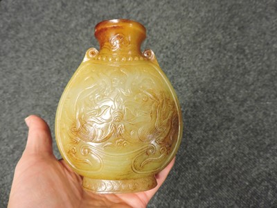Lot 99 - A pair of Chinese jade vases and covers