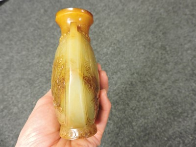 Lot 99 - A pair of Chinese jade vases and covers