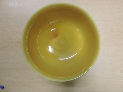 Lot 147 - A Chinese yellow glazed bowl