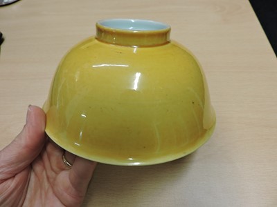 Lot 147 - A Chinese yellow glazed bowl