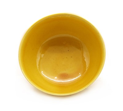 Lot 147 - A Chinese yellow glazed bowl