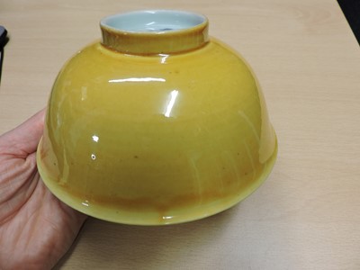 Lot 147 - A Chinese yellow glazed bowl