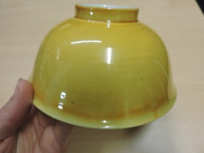 Lot 147 - A Chinese yellow glazed bowl